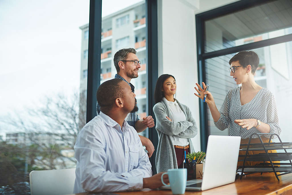 Cropped shot of a group of colleagues having a discussion in a modern office