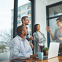 Cropped shot of a group of colleagues having a discussion in a modern office