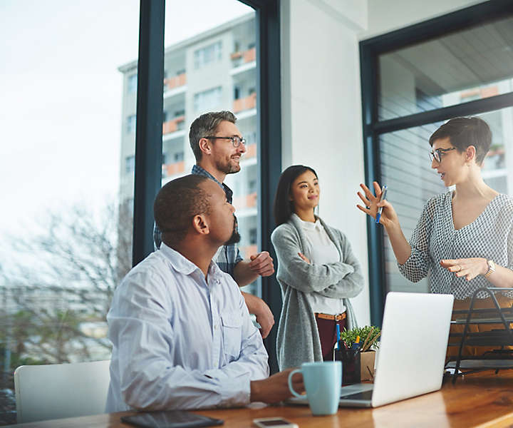 Cropped shot of a group of colleagues having a discussion in a modern office