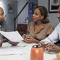 Couple talking to financial advisor