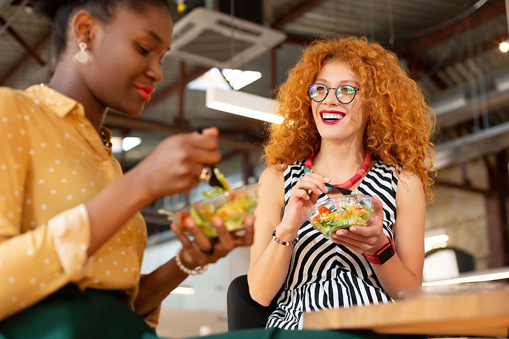 Two women having lunch and laughing