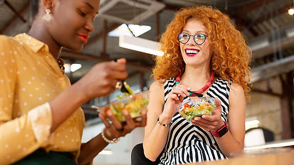 Two women having lunch and laughing