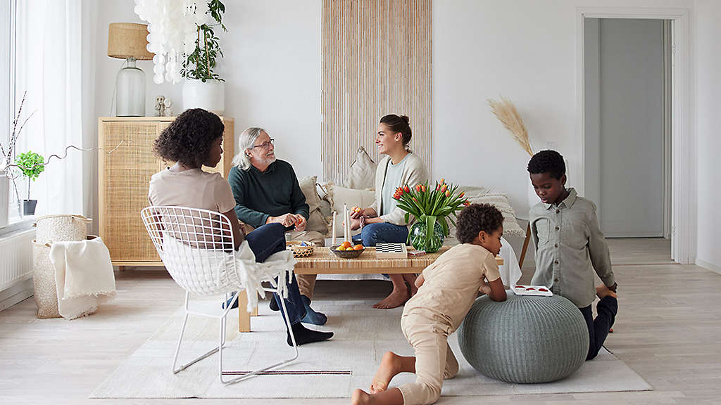 Family relaxing and playing games at home