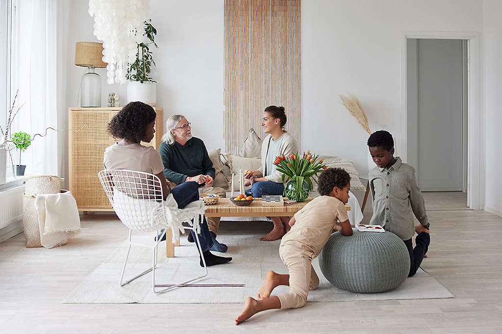 Family relaxing and playing games at home