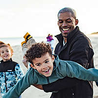 Family playing on beach