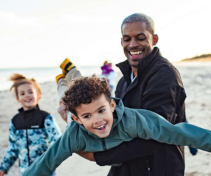 Family playing on beach