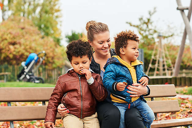 Mom on bench with kids