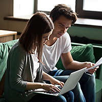 Couple looking over paperwork.