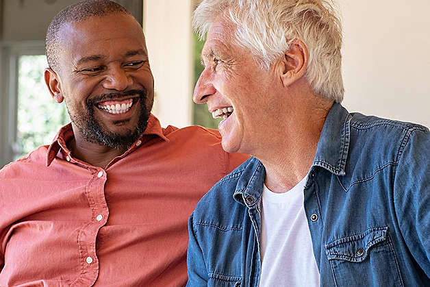 Two men laughing together