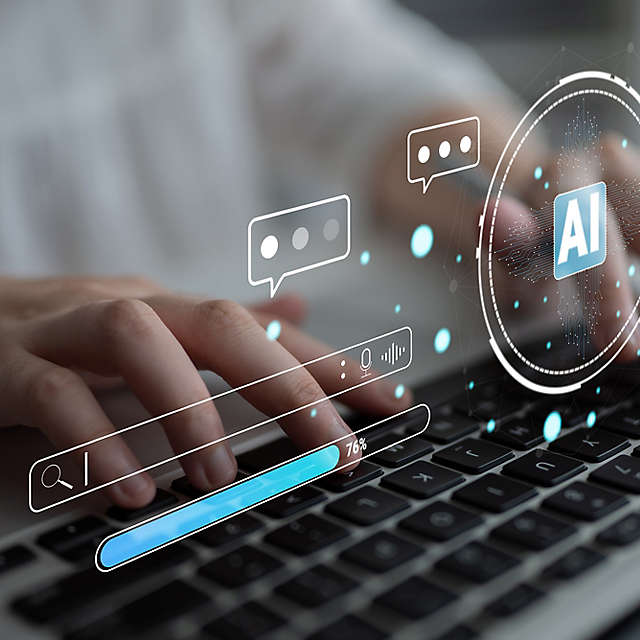  A person typing on a keyboard with an AI symbol
