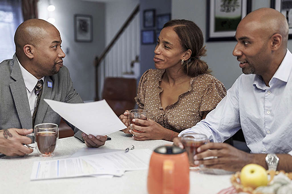 Couple talking to financial advisor