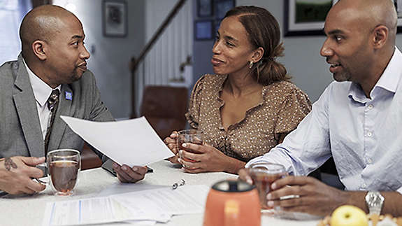 Couple talking to financial advisor