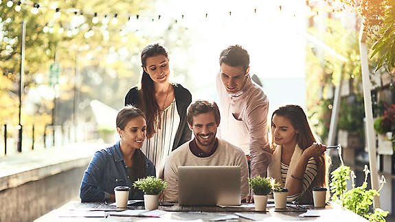 employees-gathered-at-computer-3x2