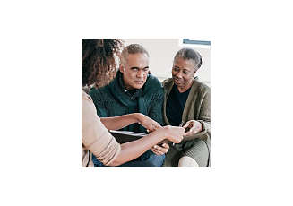 senior couple looking at paperwork given from financial advisor 