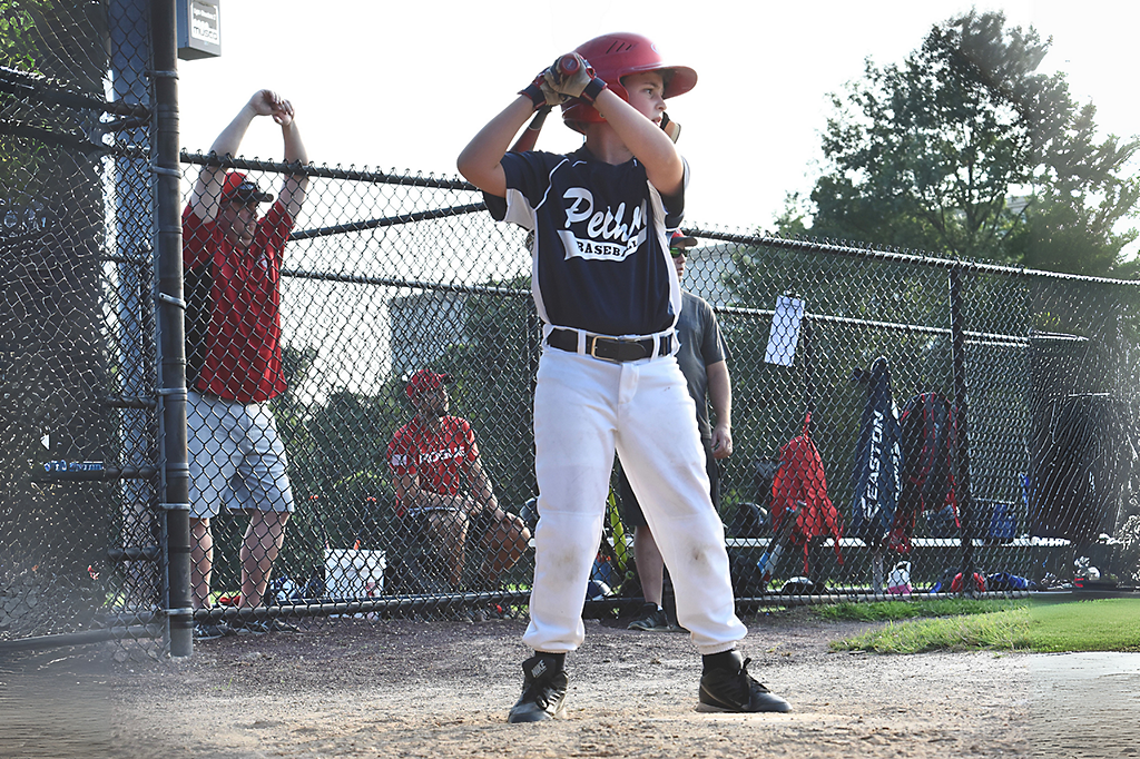 A kid playing baseball