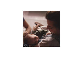 mother holding baby in her arms