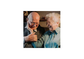 happy senior woman touching husband face