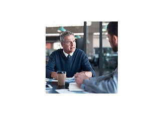 two male employees having a meeting in a office