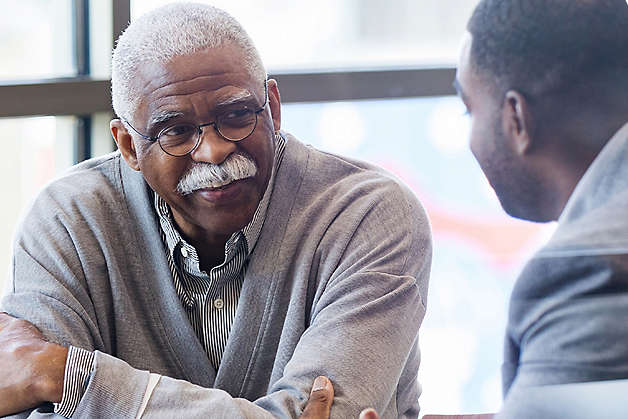 Adult and senior having a discussion