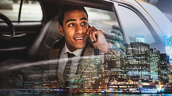 Businessman on a yellow cab in New York City