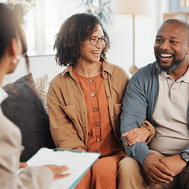 Couple talking to advisor