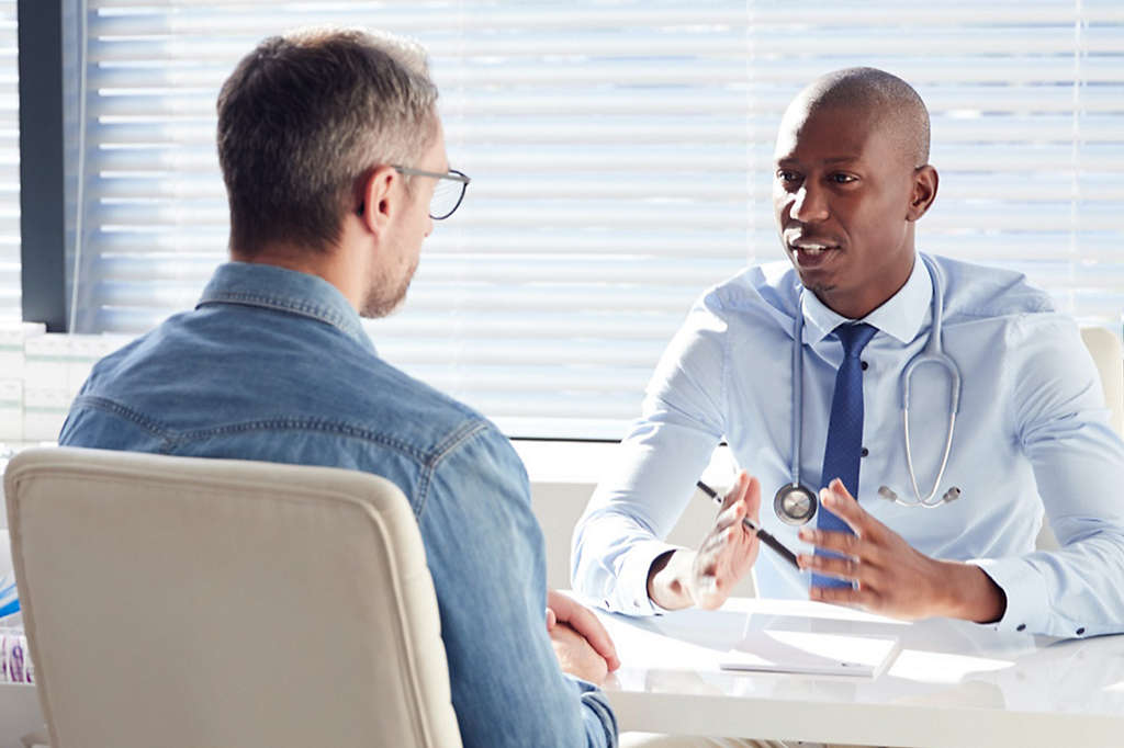 Man talking with doctor