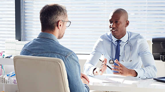 Man talking with doctor