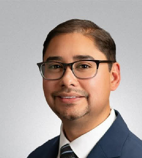 Headshot of James Miguel Quintana