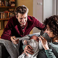 Happy new parents their holding baby 