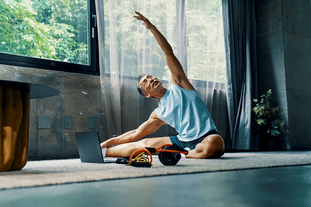 Older man stretching to keep in shape