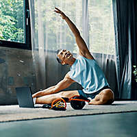 Older man stretching to keep in shape