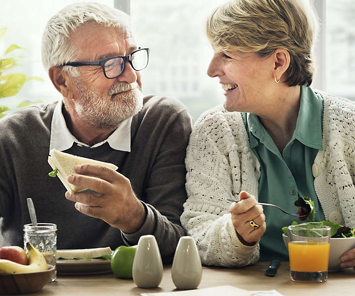 Retired couple eats a relaxing breakfast