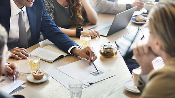 Group of professionals reviewing documents