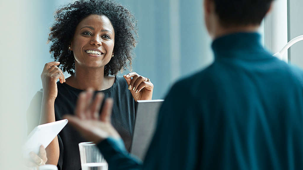 smiling financial professional in office