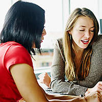 Two financial professional discuss life insurance