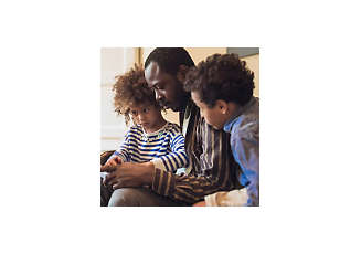 father and two children using a tablet