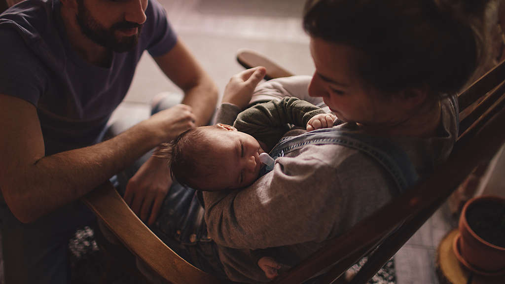 Young parents with their newborn baby